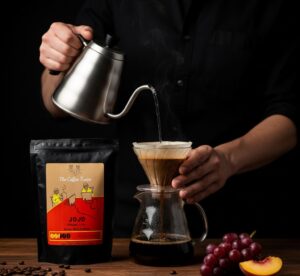 Close-up of the coffee bloom in a pour over dripper, a crucial step for pour over coffee for beginners.
