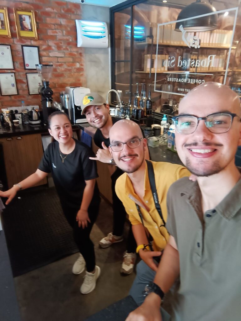 the coffee twins in Roasted Sip Cafe in Brunei with staff