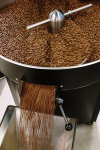 coffee beans being roasted in a machine