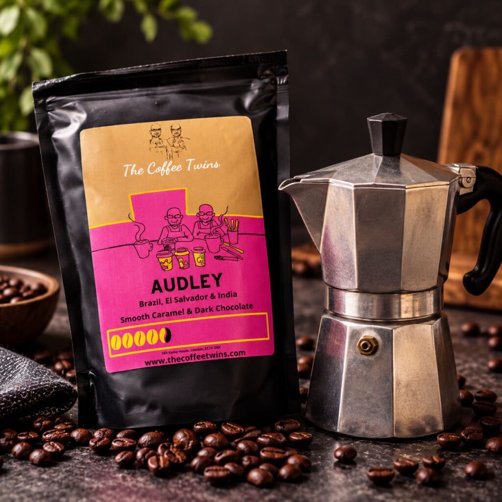 The Coffee Twins Audley coffee beans with a traditional moka pot, showing coffee beans ready for stovetop brewing.