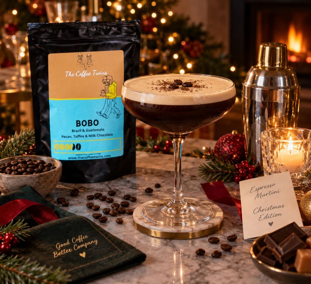 Christmas espresso martini made with The Coffee Twins Bobo coffee, served beside the coffee bag in a cosy festive home setting.