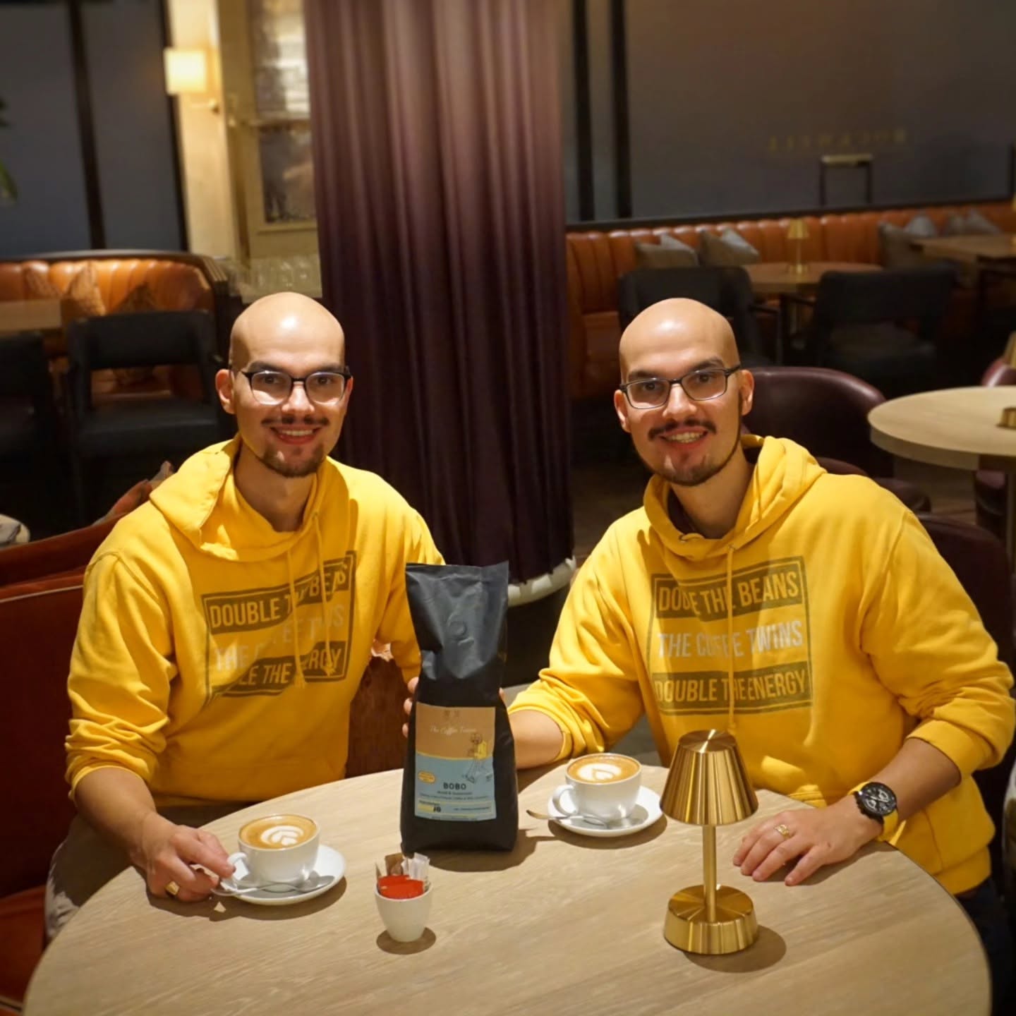 The Coffee Twins enjoying speciality coffee with a Bobo coffee bag at a luxury hotel restaurant in London.