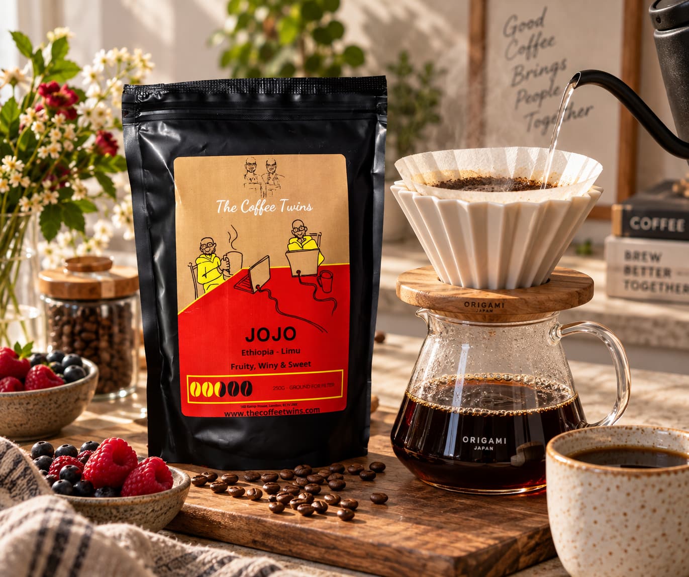 The Coffee Twins Jojo Ethiopian coffee bag beside an Origami pour-over dripper brewing fresh filter coffee.