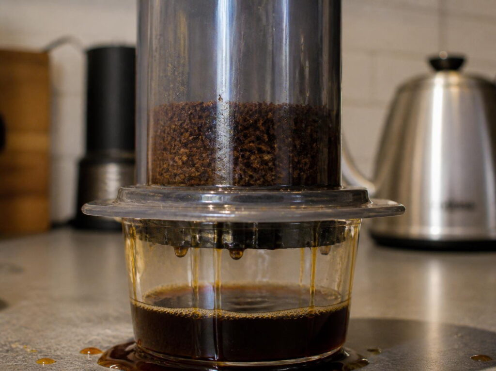 AeroPress brewing with coffee grounds that are too coarse, resulting in a fast, uneven extraction and a weak-looking cup of coffee.