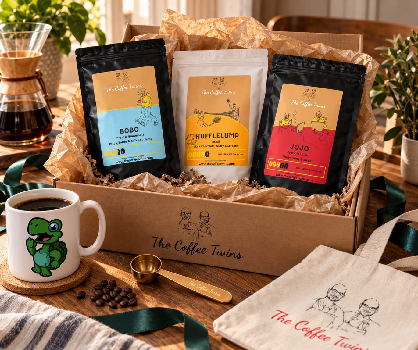 The Coffee Twins coffee hamper featuring Bobo, Hufflelump decaf and Jojo speciality coffee, presented with a branded mug and tote bag.